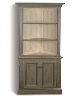 an old wooden china cabinet with two doors and one door open on the top shelf