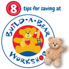 a teddy bear sitting next to a sign that says build - a - bear workshop