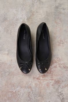 We’ve given the classic ballet flat a little glow up. Stand out in our glamorous Jolie Pearl Ballet Flat crafted from Black leather with faux pearl heel detailing. With cute gold tipping on the bow these ballet flats are comfortable and chic, perfect for any look. Ballet Flat, Black Flats, Ballet Flats, Faux Pearl, Black Leather, Ballet, Heels, Leather, Gold