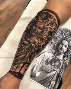 a man's arm with tattoos on it and an image of jesus in the background