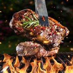 a steak being grilled on top of a grill with a knife sticking out of it