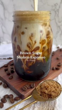 brown sugar shaker espresso in a jar next to coffee beans and spoon