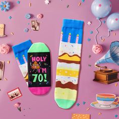 two birthday socks with candles on them and confetti