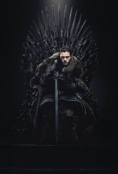 a man sitting on top of a iron throne