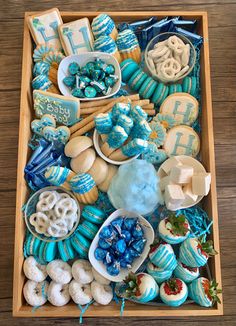 a tray filled with blue and white desserts