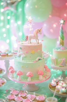 a table topped with lots of cakes and cupcakes