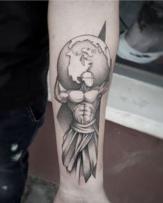 a man's arm with a black and white tattoo on it