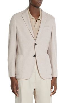 Offering jersey comfort with a tailored look, this jacket features sport coat styling with the fit and feel of a rich knit from cotton with leather details. Notched lapels Nonfunctional four-button cuffs Chest welt pocket; front patch pockets Side vents Partially lined 100% cotton with leather trim Professional leather clean Made in Italy Designer Clothing Casual Beige Blazer For Semi-formal Occasions, Beige Wool Sport Coat For Business Casual, Beige Sport Coat With Button Closure For Business Casual, Beige Business Casual Sport Coat With Button Closure, Cream Sport Coat With Notch Lapel For Workwear, Cream Single Breasted Sport Coat For Business, Cream Blazer With Hidden Button For Business Casual, Tailored Cream Business Sport Coat, Tailored Cream Sport Coat For Business