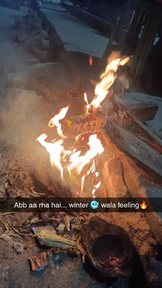 a fire is burning in the middle of a pile of trash and debris with an ad that reads abb aa tha hai winter waale wala feeling