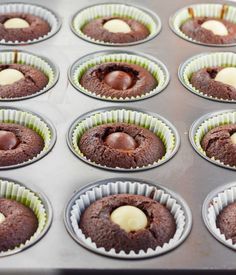 chocolate cupcakes are lined up and ready to be baked into muffin tins