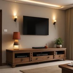 a flat screen tv mounted to the side of a wooden entertainment center in a living room