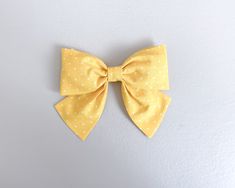 This adorable yellow polka dot bow from Simply Ellie is perfect for spring or summer. This is our larger design for older girls and for girls with more hair! Yellow Polka Dot, For Girls, Polka Dot, Polka Dots, This Is Us, Dots, Yellow, Hair, Design