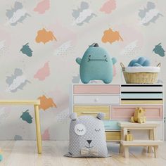 a child's room with colorful wallpaper and wooden furniture, including a teddy bear