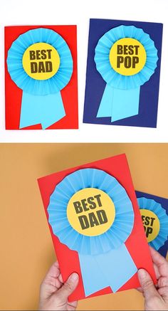 the father's day card has been made with paper and is being held up