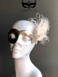 Champagne masquerade mask with ivory peacock feathers and rhinestone embellishment piece.  Perfect for a masquerade party, birthday celebration, or New Years Eve celebration.  Browse more Masks - https://www.etsy.com/shop/higginscreek More photos: Instagram @masks_by_higginscreek Facebook.com/higginscreek Add Rhinestones to your mask! https://www.etsy.com/listing/623069691/add-rhinestones-to-your-masquerade-mask?ref=shop_home_active_4 S H I P P I N G -  Processed same day or within 24 hours.  1- Elegant Feathered Eye Mask For Masquerade, Elegant Feathered Masquerade Mask For Mardi Gras, Elegant Feathered Masquerade Mask, Elegant Feathered Masquerade Mask For Costume Party, Elegant Headpieces For Masquerade Carnival, Elegant Headpieces For Carnival Masquerade, Elegant Masquerade Mask For Wedding And Mardi Gras, Kids Party Packs, Elegant Face Mask