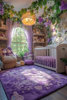 a baby's room decorated in purple and green with lots of greenery on the walls