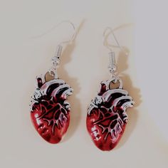 Uniquely Made Heart Organ Hook Earrings. Made Of Zinc Alloy Metal And Polished With Red & Silver. Hooks Are Nickel Free. Brand New Boutique Item. Mix And Match Any Items Listed For 4 For $20 Just Bundle Items And Send Offer. Heart Organ, Hook Earrings, Mix And Match, Zinc Alloy, Jewelry Earrings, Women Jewelry, Boutique, Silver, Red