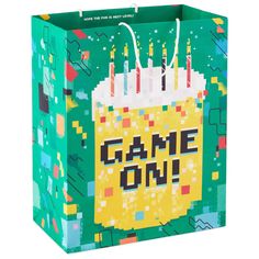 a birthday bag with candles on it and the words game on written in large letters