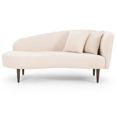 a white couch with three pillows on it's back and two arms, sitting in front of a white background