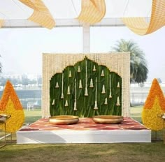 Embrace the traditional South Indian wedding aesthetic by incorporating lush banana leaves as the primary décor element for your Haldi ceremony. Complement the green foliage with garlands of tuberose and marigold flowers for a truly authentic and captivating ambiance. Nalugu Backdrop, Decoration Ideas For Haldi, Mehendi Stage, Leaf Decoration Ideas, Haldi Theme, Simple Crib, Haldi Celebration, Thread Ceremony, Leaf Decor Wedding