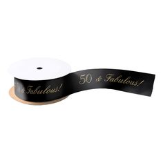 a black ribbon with gold lettering on it