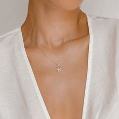 This chain necklace is made from 925 sterling silver and has a small pendant hanging from the center front of it with five, clear-coloured oval-shaped (Marquise-cut) zircon stones arranged in a flower shape. It fastens at the back with a small round spring clasp, where it also has an extension chain (made from larger links) which makes the whole necklace adjustable. Dainty and a touch feminine, this necklace will pair well with anything from classic white tees to small floral prints to bold colo Layered Necklace Silver, Real Gold Necklace, Real Gold Chains, Layered Pearl Necklace, Daisy Charm, Flower Daisy, Layered Necklaces Silver, Daisy Necklace, Necklace Flower