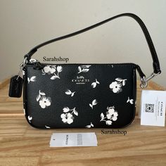 100% Authentic Brand New With Tags Bag Comes In Original Packaging Cp476 Black White Floral Nolita 19 Black Multi And Silver Hardware Approximate Measurements: 8″ (L) X 4.5″ (H) X 2″ (W) Handle With 6" Drop For Shoulder Wear Black Clutch Bag For Spring, Spring Coach Pouch Bag, White Clutch Bags With Silver-tone Hardware, Nolita 19, Small Shoulder Bags, Girly Bags, Coach Bag, Coach Purses, Silver Hardware