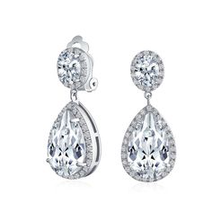 PRICES MAY VARY. STUNNING DESIGN- Bring out your inner glam with these stunning clear CZ silver plated teardrop earrings. Fit for a fashionista and bride, these stunners have CZ stones surrounding the teardrop crystal. Order these today. Measure: 2 inch L x 0.5 inch W Weight: 13.4 gram Material: Brass, Silver Plating, Cubic Zirconia Affordable Alterative to Diamonds-Buy Cubic Zirconia: Show your love for the Earth and your sweetheart by choosing cubic zirconia jewelry gifts. Lab created CZ reduc Teardrop Bridal Earrings, Prom Jewelry, Teardrop Dangle Earrings, Cubic Zirconia Jewelry, Cz Jewelry, Cz Earrings, Silver Earrings Dangle, Bling Jewelry, Silver Rose Gold