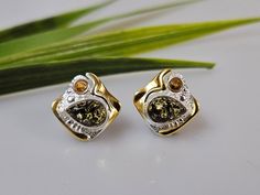 Baltic Amber + sterling silver 925. Multi colour Amber. with some gold plated parts  ,Silver 925 with hallmarks. Certificated product. Stunning stud in earrings about 1,3 cm length. Big square shape multi colour studs.  https://www.etsy.com/shop/AmberLithuania?ref=simple-shop-header-name&listing_id=780205095&section_id=27948198 This item was made of natural Baltic Amber. All the amber used in my jewelry is collected in my home country Lithuania.  I sell only genuine,  real, not pressed, authenti Fine Jewelry Yellow Earrings For Gift, Yellow Fine Jewelry Earrings For Gift, Yellow Hallmarked Earrings As A Gift, Handmade Amber Earrings For Anniversary, Unique Hallmarked Earrings For Anniversary, Earrings Big, Amber Earrings, Earrings Stud, Baltic Amber