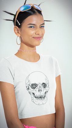 10% off with code: PINTEREST

Dare to be different with our Black Skull White 100% Cotton Organic Crop Top. 
This bewitching and eco-friendly crop top is designed to make a striking fashion statement while aligning with your love for sustainability. The organic crop top is soft, comfy, and what's more, made of 100% organic cotton. 
This premium crop is bound to become a favorite for every eco-conscious buyer.

💀 Edgy Skull Design
👕 Unisex Comfort
🎁 Ideal for Fashion Enthusiasts
🖤 Make a Bold Statement
🌿 Organic Cotton Comfort
🛡️ Durable 100% combed and ring-spun cotton
🍂 Quality and Sustainability
🎃 Perfect for Halloween Punk Style Skull Graphic Tops, Alternative Style White Skull Print Top, Alternative White Top With Skull Print, White Alternative Style Top With Skull Print, Edgy White Skull Print Top, White Skull Print Alternative T-shirt, Alternative White T-shirt With Skull Print, Edgy White Top With Skull Print, Fitted T-shirt With Skull Graphic Print