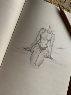 a pencil drawing of a woman sitting on the beach