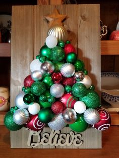 a christmas tree made out of ornaments on top of a table