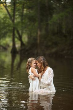 two women in the water hugging each other