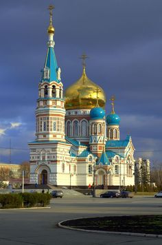 an ornate building with blue and gold domes