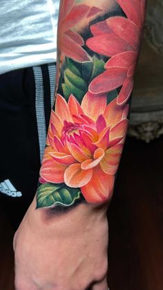 a person with a flower tattoo on their arm