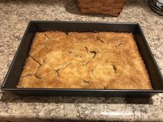 a baking pan filled with food on top of a counter