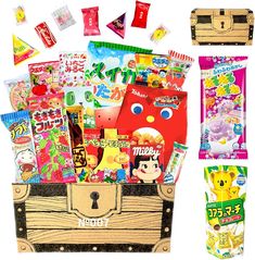 an assortment of candy and snacks in a wooden box with the word happy on it