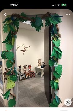 an open door with paper jungle decorations on it