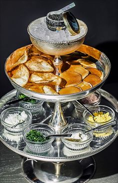 a silver platter filled with food on top of a table