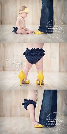 a baby wearing yellow high heels is being held by someone's leg and feet