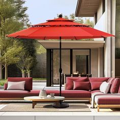 an outdoor living area with red furniture and umbrella