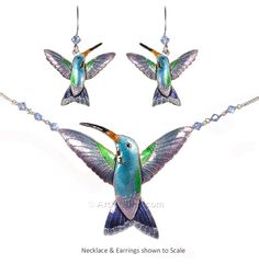 three pieces of jewelry including a necklace and earring set with hummingbirds on them