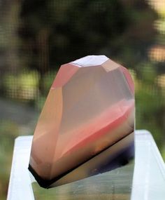 a piece of glass sitting on top of a table