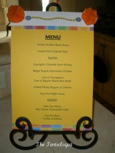 a yellow menu board sitting on top of a counter