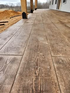 an outdoor deck with wood planks on it