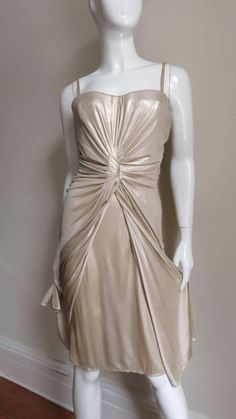 For Sale on 1stDibs - A gorgeous soft gold fine silk knit dress from Christian Dior. It has an inner boned corset with underwire bust cups, and detachable spaghetti straps enabling Gold Dress With Spaghetti Straps And Fitted Bodice, Gold Dresses With Spaghetti Straps And Fitted Bodice, Elegant Gold Dress With Corset Back, Gold Strapless Fitted Evening Dress, Champagne Strapless Evening Dress With Fitted Bodice, Silk Strapless Evening Dress With Boned Bodice, Gold Ruched Evening Dress For Gala, Elegant Gold Dress With Boned Bodice, Fitted Silk Evening Dress With Spaghetti Straps