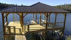 a wooden dock sitting on top of a body of water