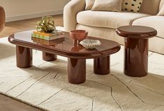 a living room with a couch, coffee table and two end tables on the floor