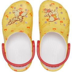 Little ones will enjoy the fun characters and Iconic Crocs Comfort in the Toddler’s Classic Winnie the Pooh Clog. Featuring an all-over character graphic and enlarged Jibbitz charms depicting all the favorite characters, these are sure to become their favorite pair. Winnie The Pooh Crocs, Vans Socks, Vans Hats, Disney With A Toddler, Fun Graphics, Fun Characters, Classic Winnie The Pooh, High Heel Slippers, Character Graphic