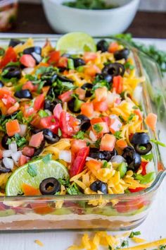 a glass casserole dish filled with mexican salad